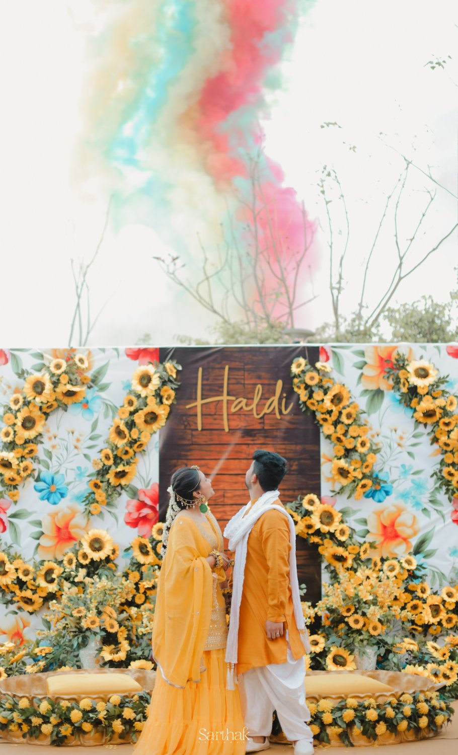 Couple at haldi backdrop