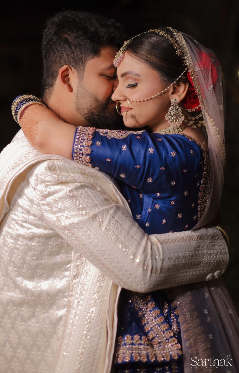 Couple embracing at night