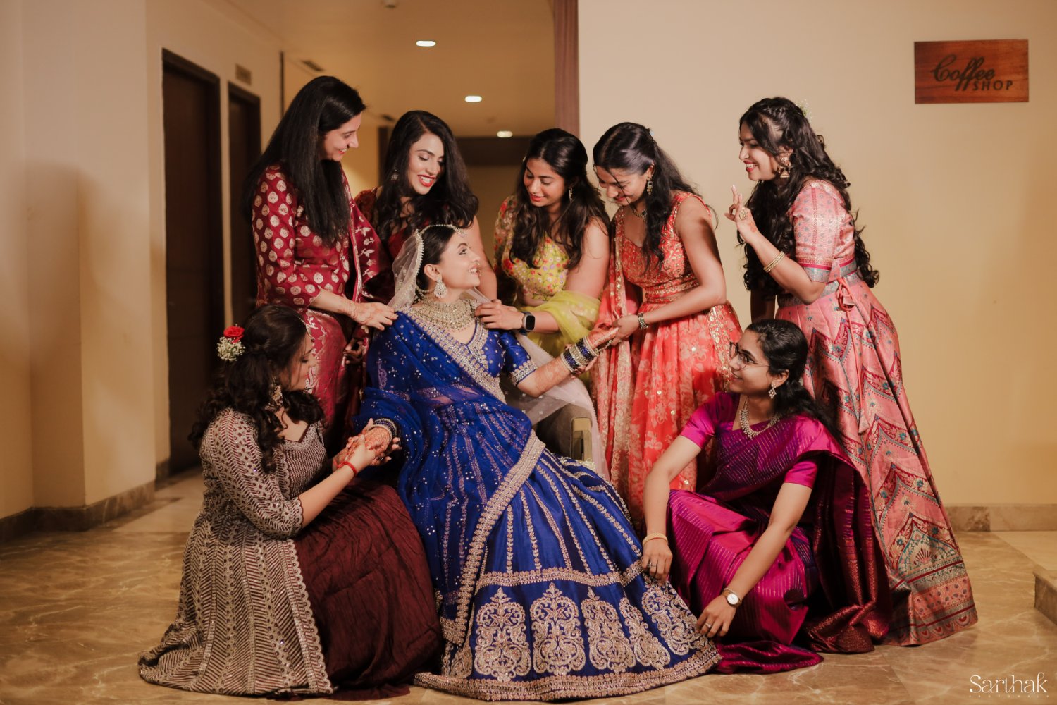 Bridesmaids helping the bride